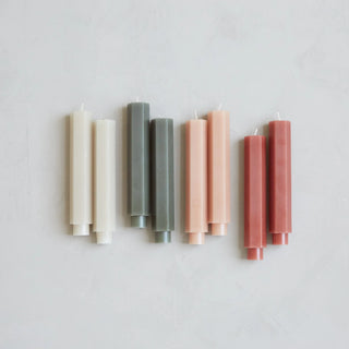 short hexagonal 6" taper candles in parchment, moss, blush and clay colors from slope house mercantile home decor store